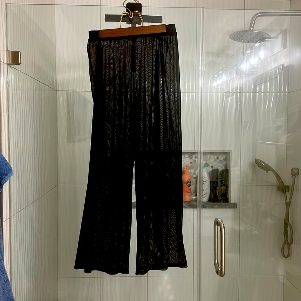 Black cover up pants for swim suit . Sheer